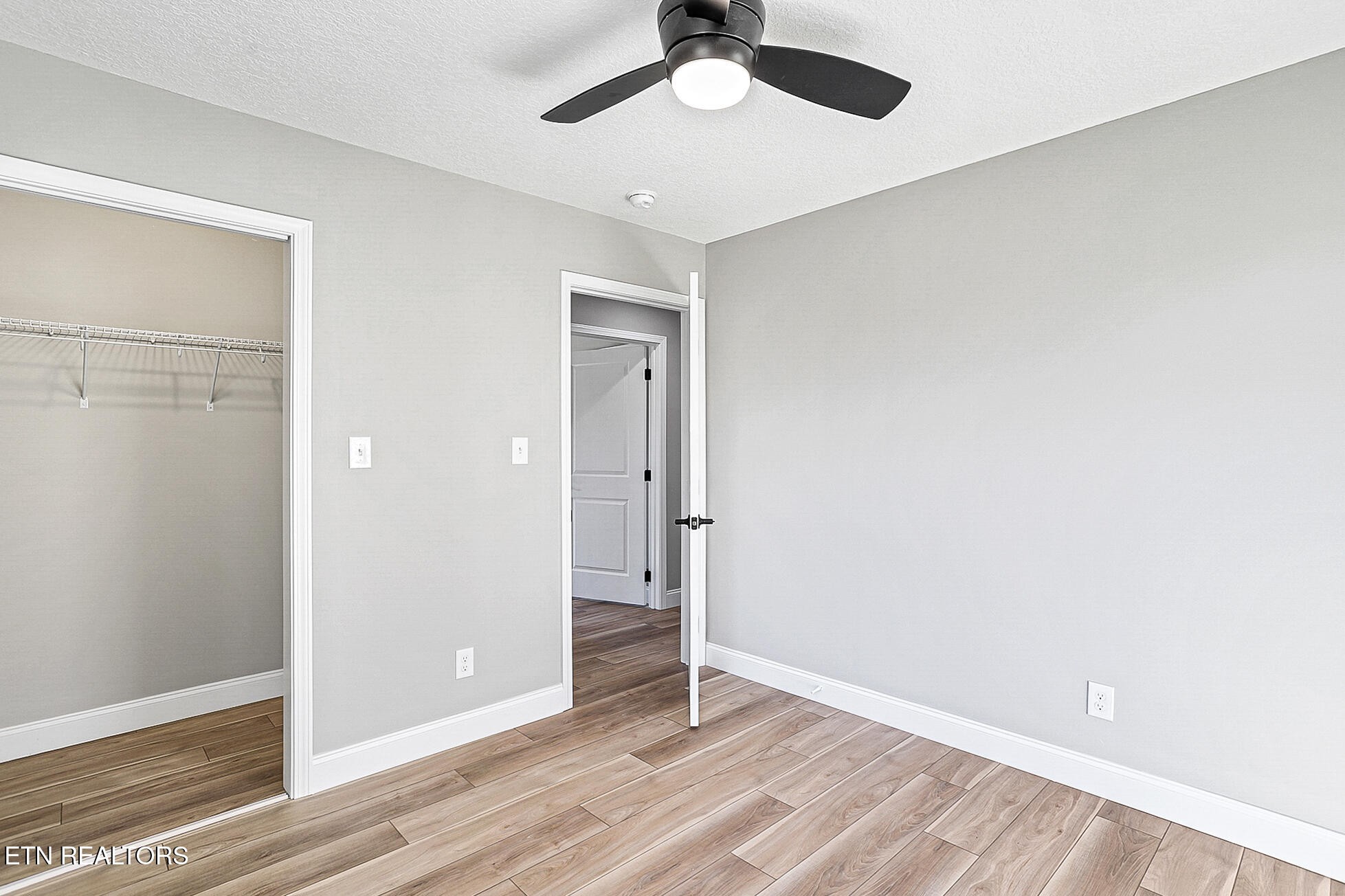 1134 Rider Avenue Knoxville, TN 37917 - Photo 34 of 44 a view of an empty room with wooden floor