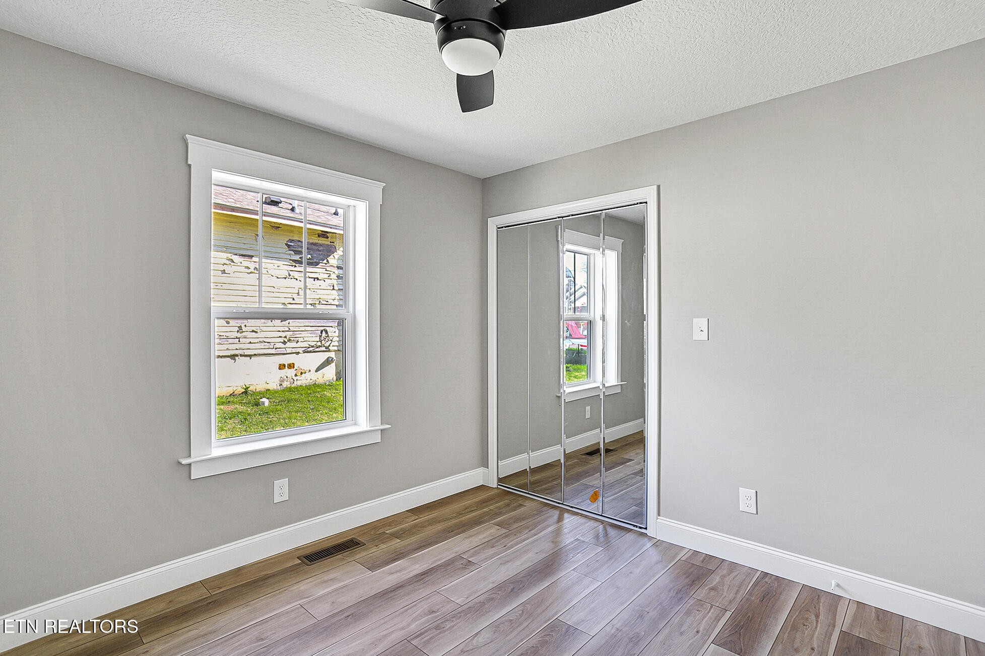 1134 Rider Avenue Knoxville, TN 37917 - Photo 37 of 44 wooden floor in an empty room with a window