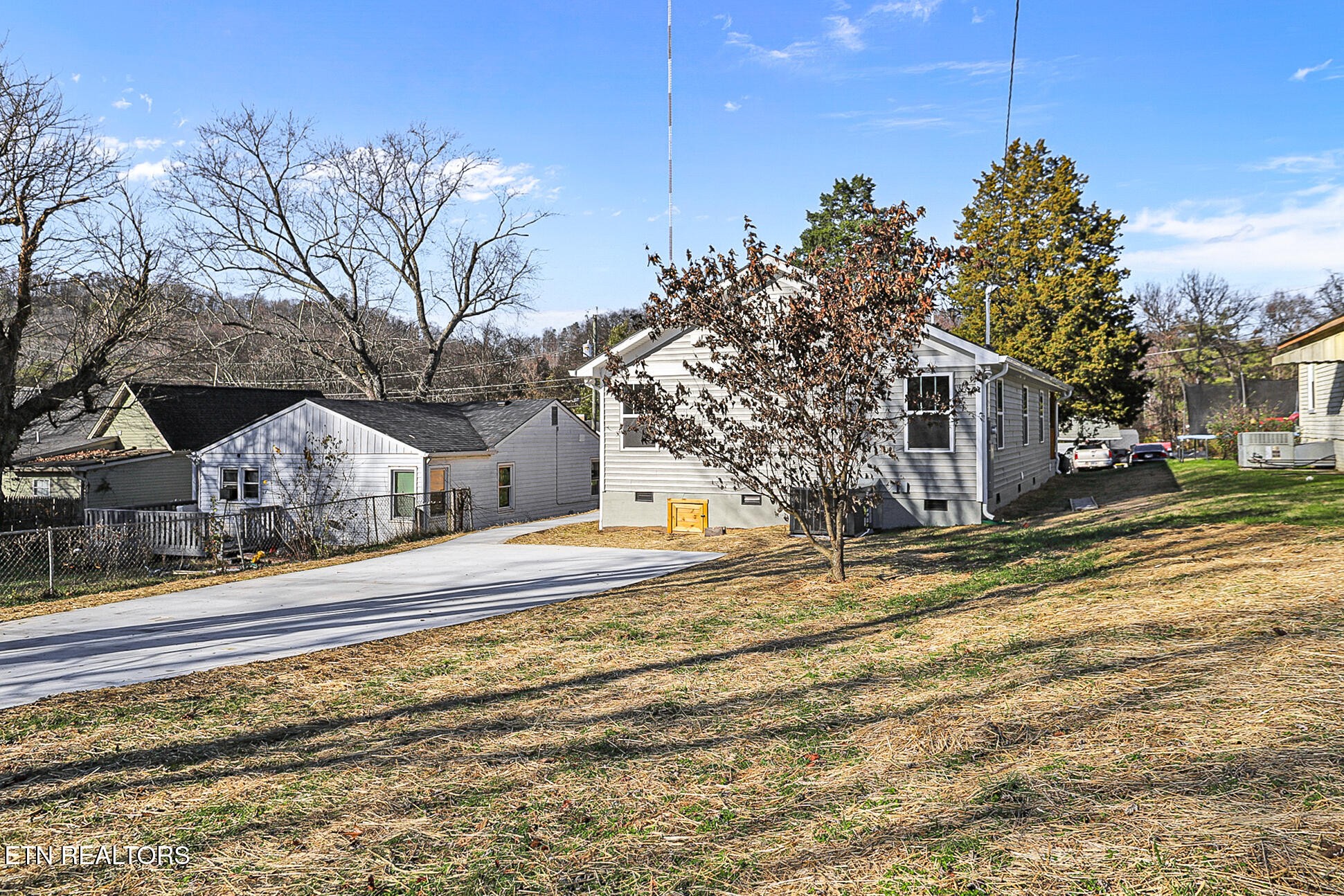 1134 Rider Avenue Knoxville, TN 37917 - Photo 43 of 44 a yellow house with trees in front of it
