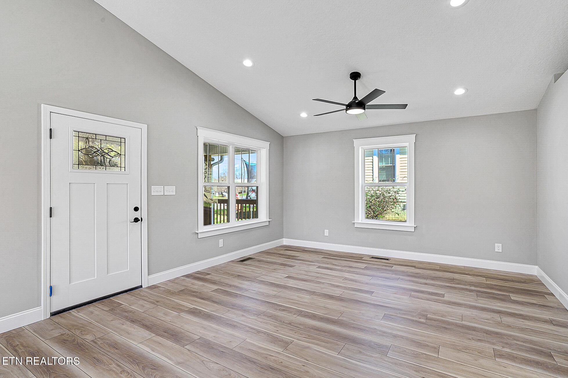 1134 Rider Avenue Knoxville, TN 37917 - Photo 8 of 44 wooden floor in an empty room with a window