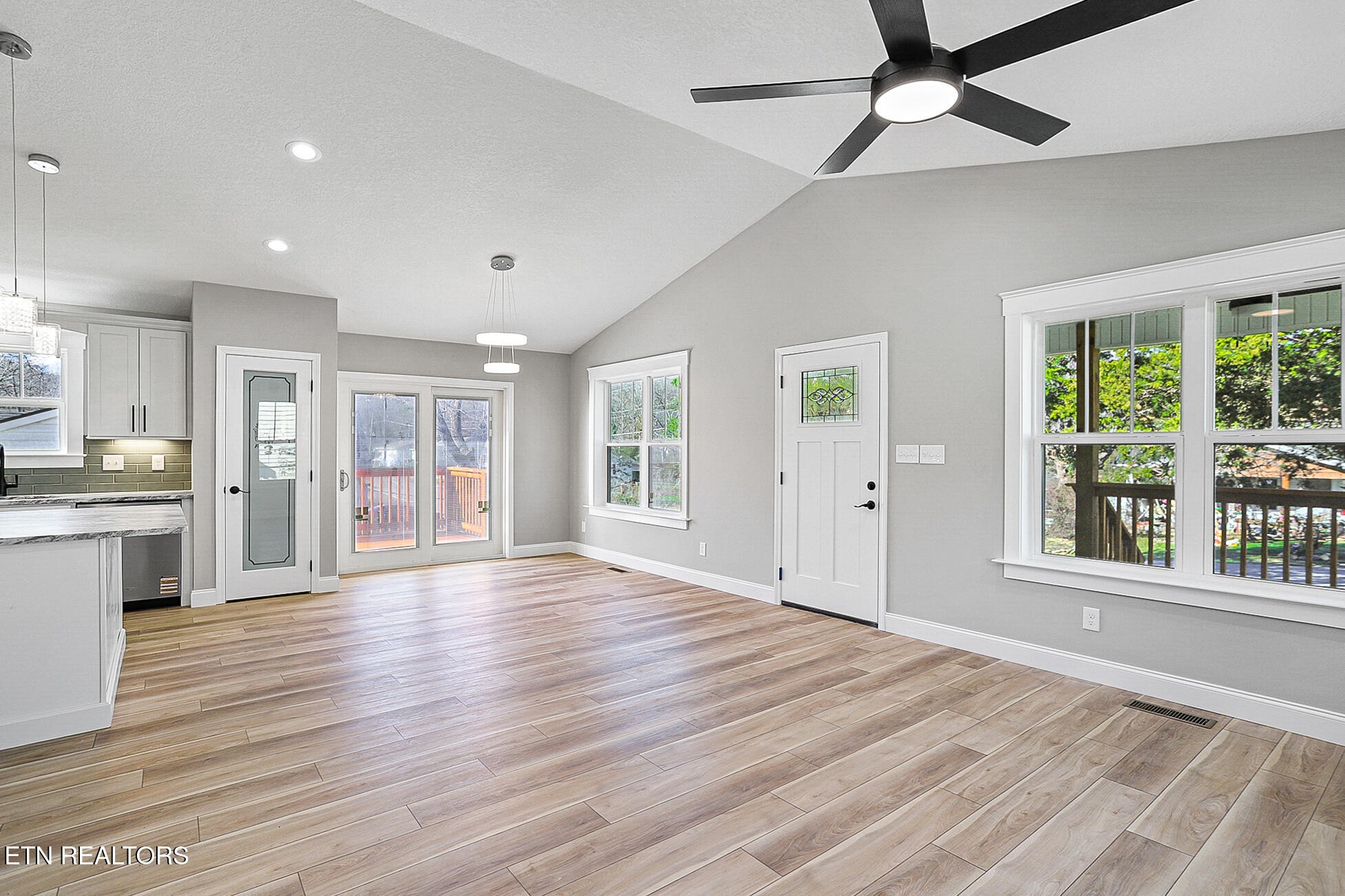 1134 Rider Avenue Knoxville, TN 37917 - Photo 9 of 44 a view of an empty room with wooden floor and a window