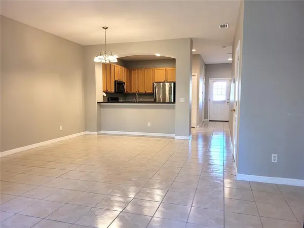 a view of a kitchen and a window