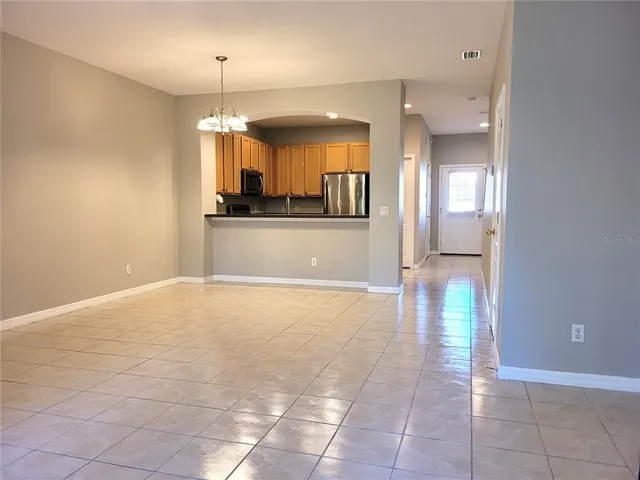 a view of a kitchen with microwave and cabinets