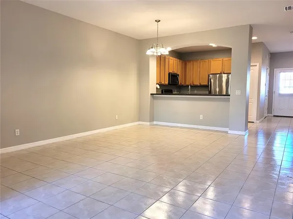 a view of a kitchen and a window
