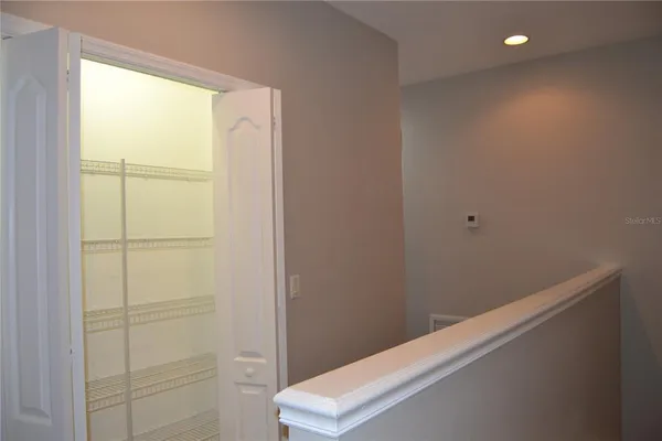 an empty room with wooden floor and a window