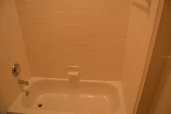 a view of a bathroom with a glass door and garden