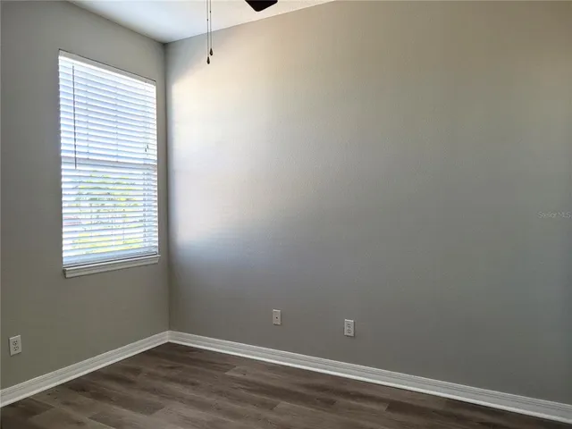 a couple of potted plants in front of door