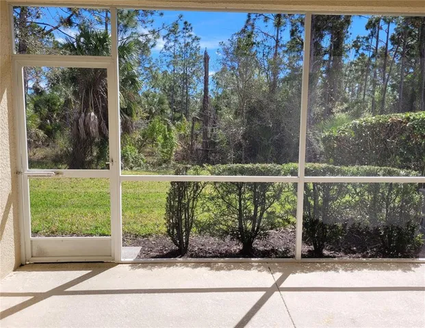 a living room with lots of white furniture