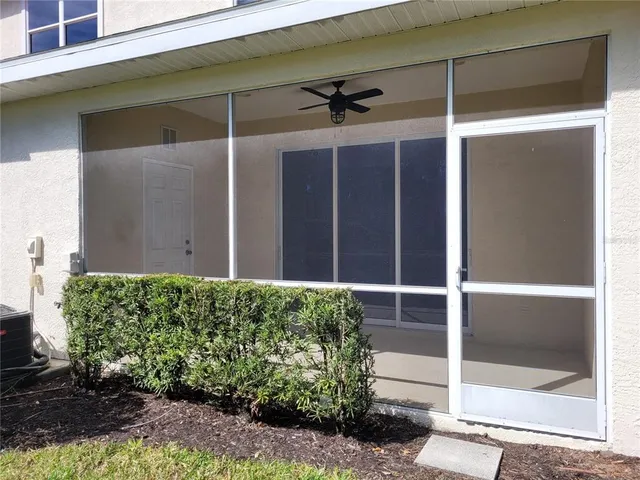 a view of deck with wooden fence and trees