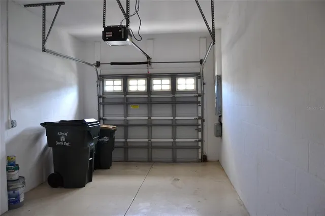 a view of a swimming pool with outdoor seating