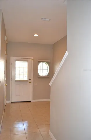 a view of an empty room with a window