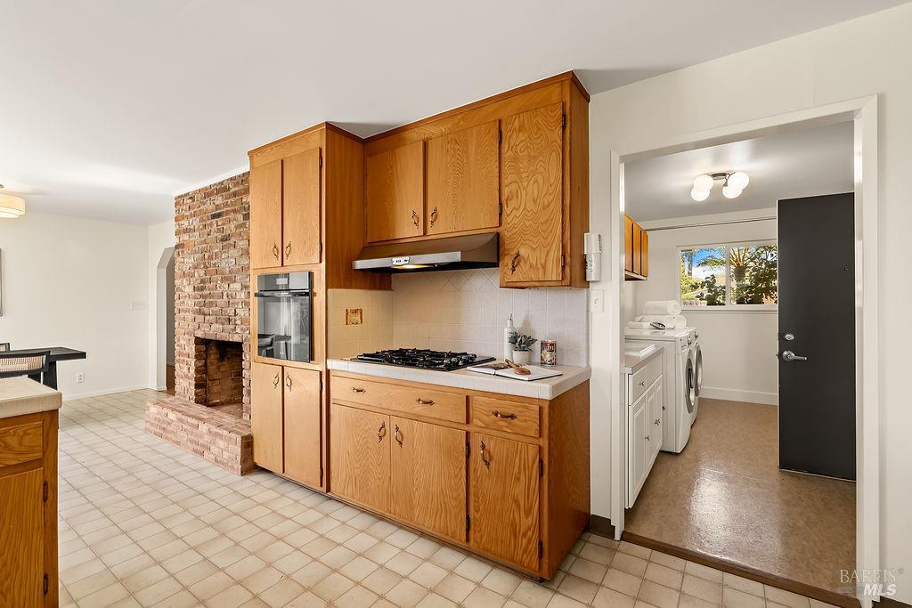 878 Pauline Court Santa Rosa, CA 95401 - Photo 11 of 36 a kitchen with stainless steel appliances granite countertop a stove top oven a sink a counter space and cabinets