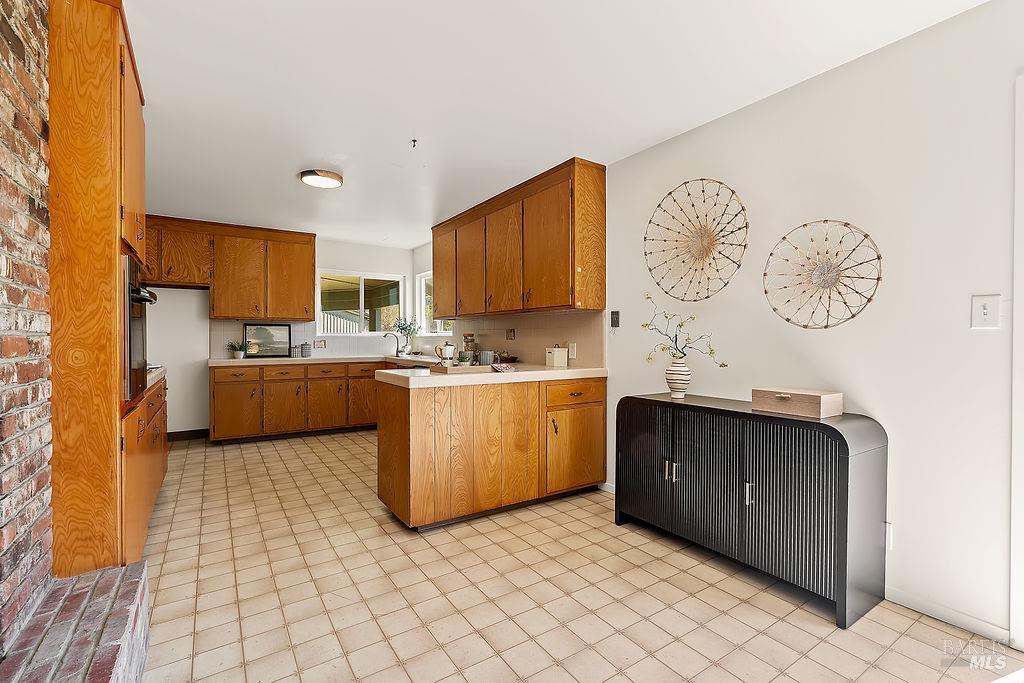 878 Pauline Court Santa Rosa, CA 95401 - Photo 8 of 36 a kitchen with a cabinets and window