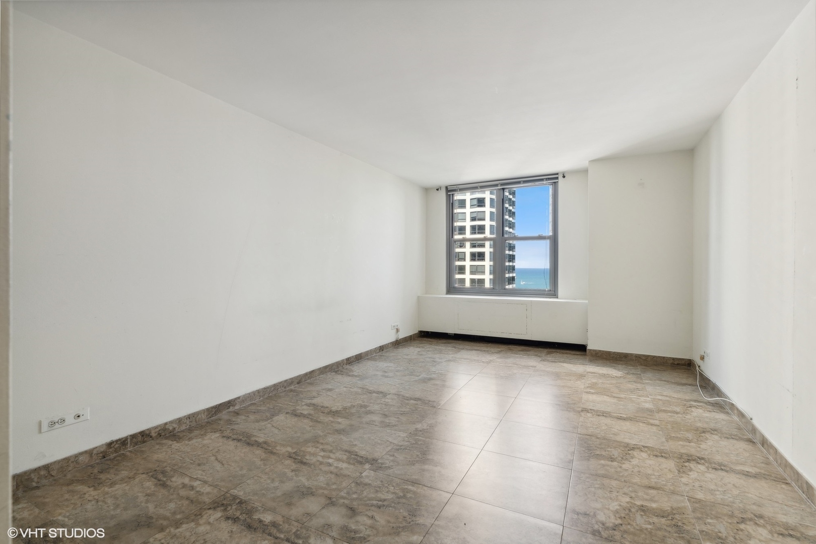 400 East Randolph Street, Unit 2525 Chicago, IL 60601 - Photo 11 of 23 an empty room with windows