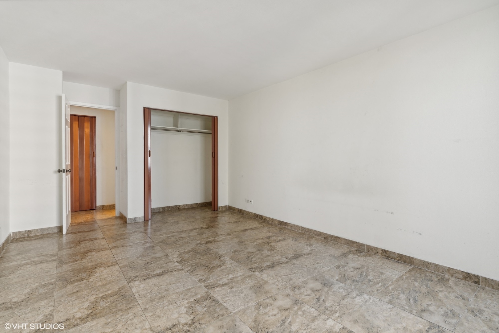 400 East Randolph Street, Unit 2525 Chicago, IL 60601 - Photo 12 of 23 an empty room with closet area