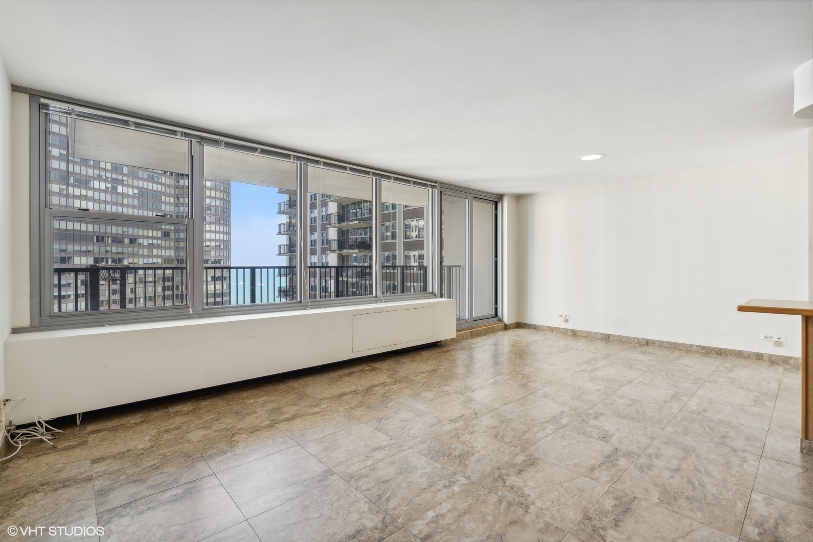 400 East Randolph Street, Unit 2525 Chicago, IL 60601 - Photo 3 of 23 a view of an empty room with a window