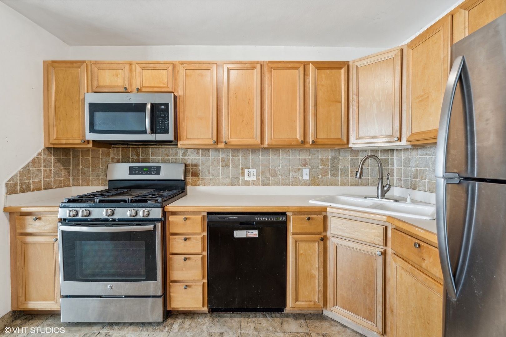 400 East Randolph Street, Unit 2525 Chicago, IL 60601 - Photo 7 of 23 a kitchen with stainless steel appliances granite countertop a stove a refrigerator and a sink