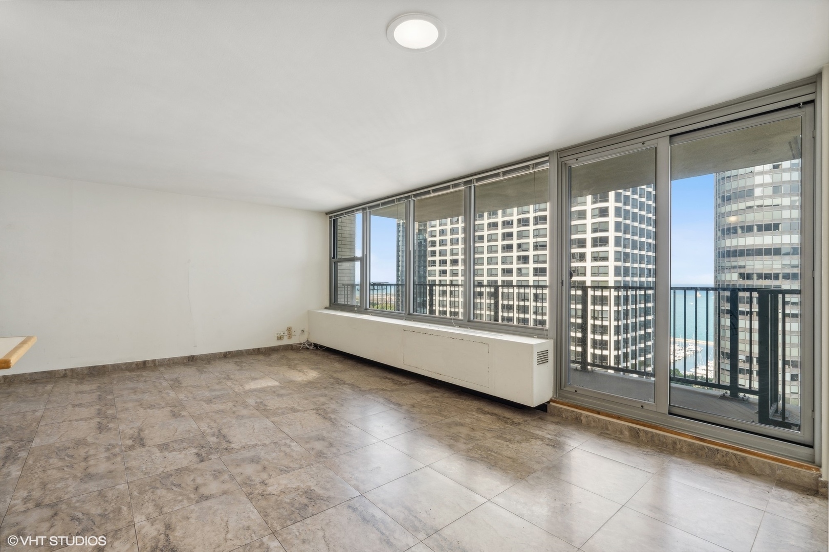 400 East Randolph Street, Unit 2525 Chicago, IL 60601 - Photo 10 of 23 a view of an empty room with a window