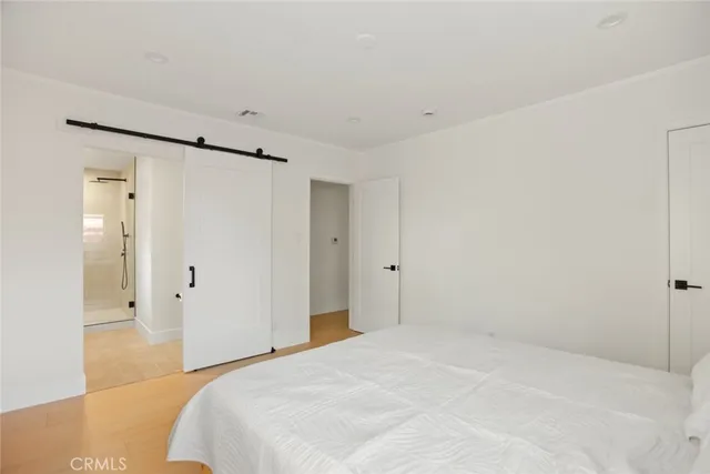 a large white bed in a white room