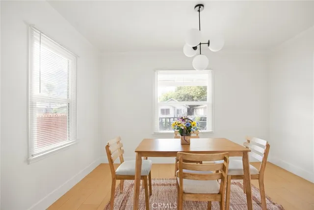a kitchen with stainless steel appliances a sink stove and cabinets