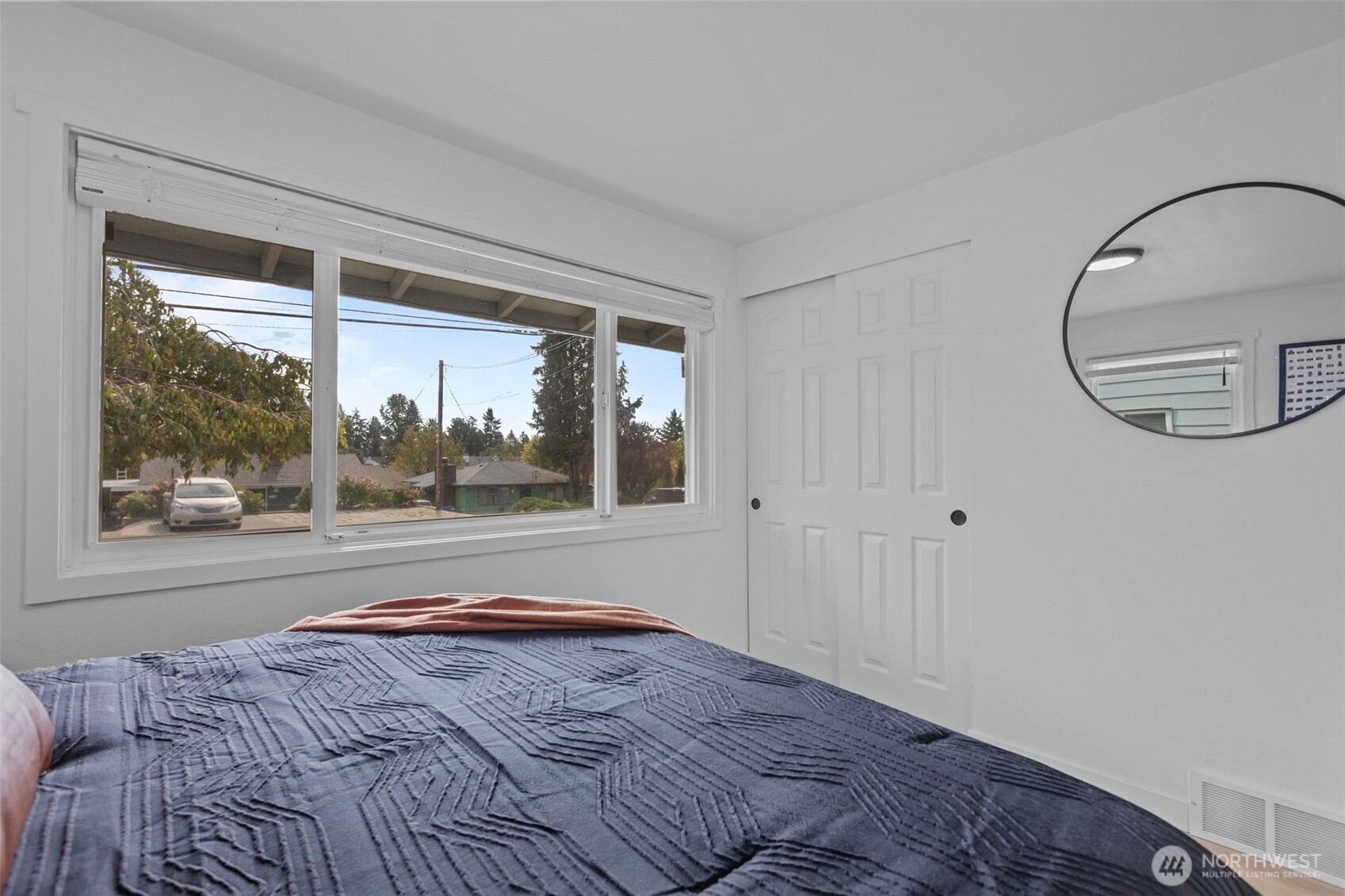 3610 Northeast 6th Street Renton, WA 98056 - Photo 13 of 33 a bedroom with a bed and a window