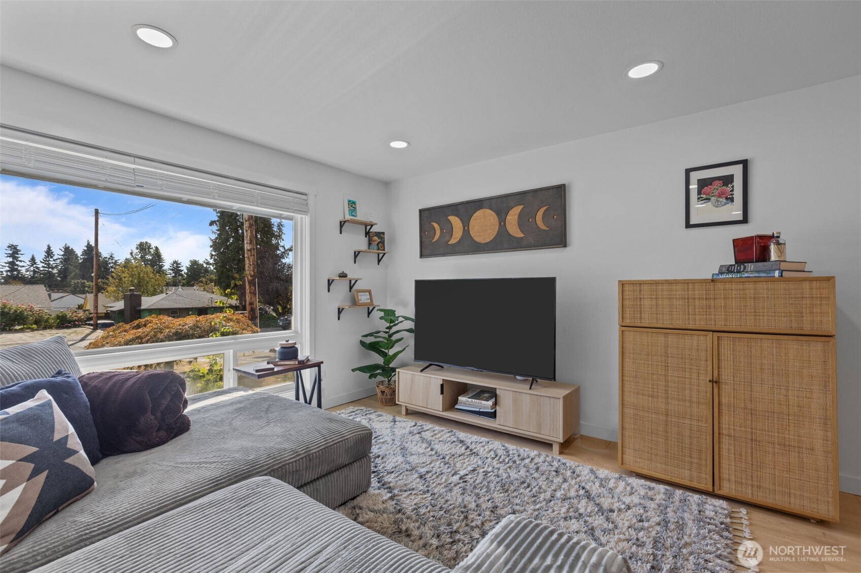 3610 Northeast 6th Street Renton, WA 98056 - Photo 2 of 33 a living room with furniture and a flat screen tv