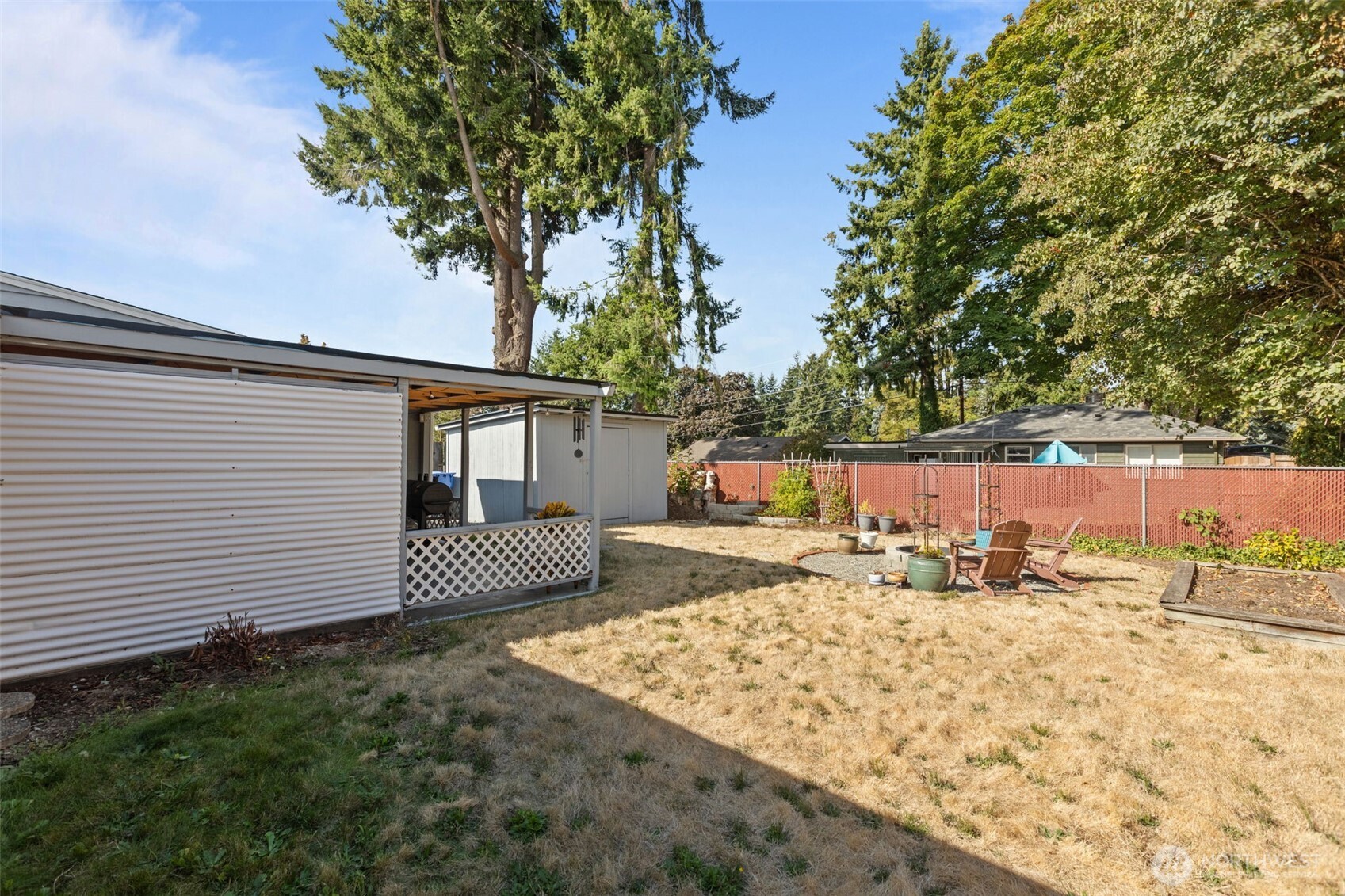3610 Northeast 6th Street Renton, WA 98056 - Photo 29 of 33 a view of a backyard with a large tree