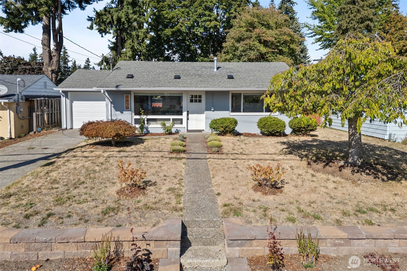 3610 Northeast 6th Street Renton, WA 98056 - Photo 31 of 33 a front view of a house with parking space