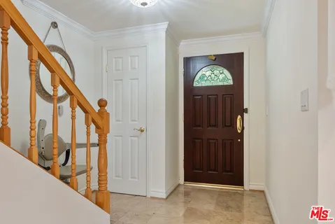 a view of front door with stairs