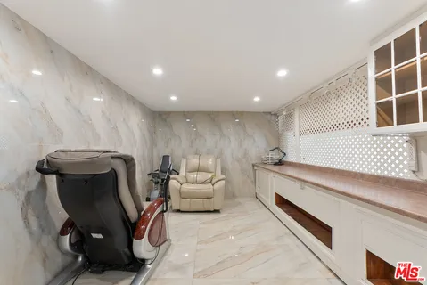 a living room with furniture and a chair