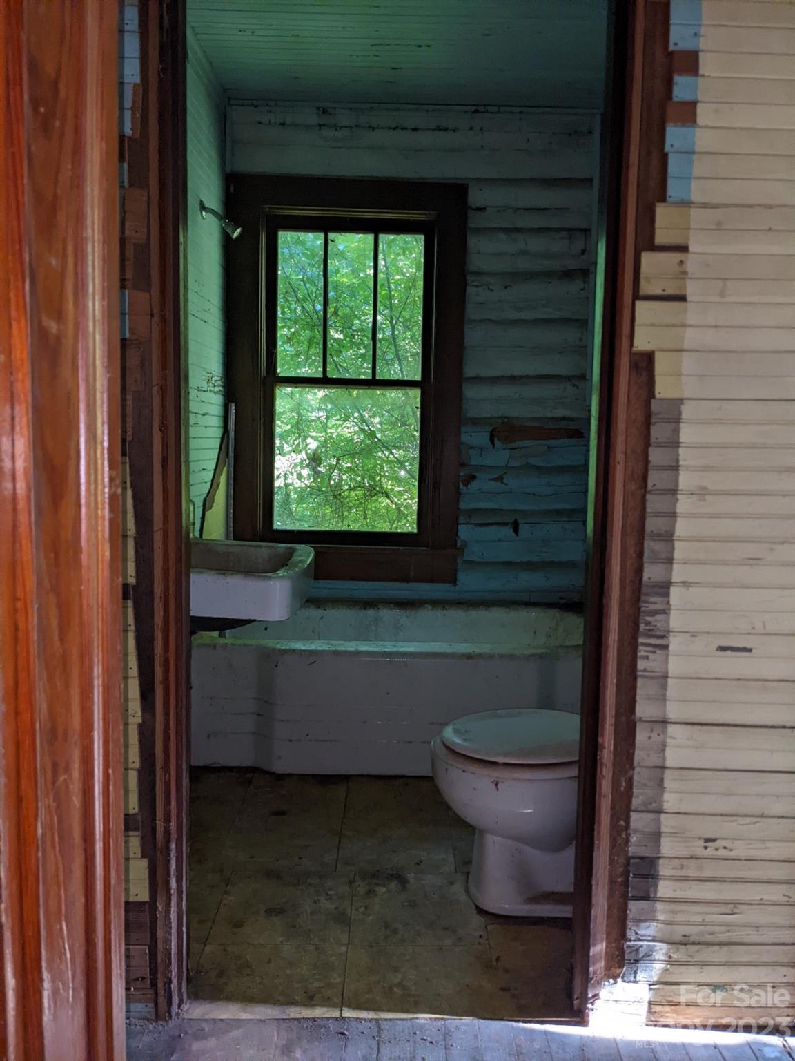 201 Clifford Fowler Road Hot Springs, NC 28743 - Photo 40 of 47 a bathroom with a toilet and a sink