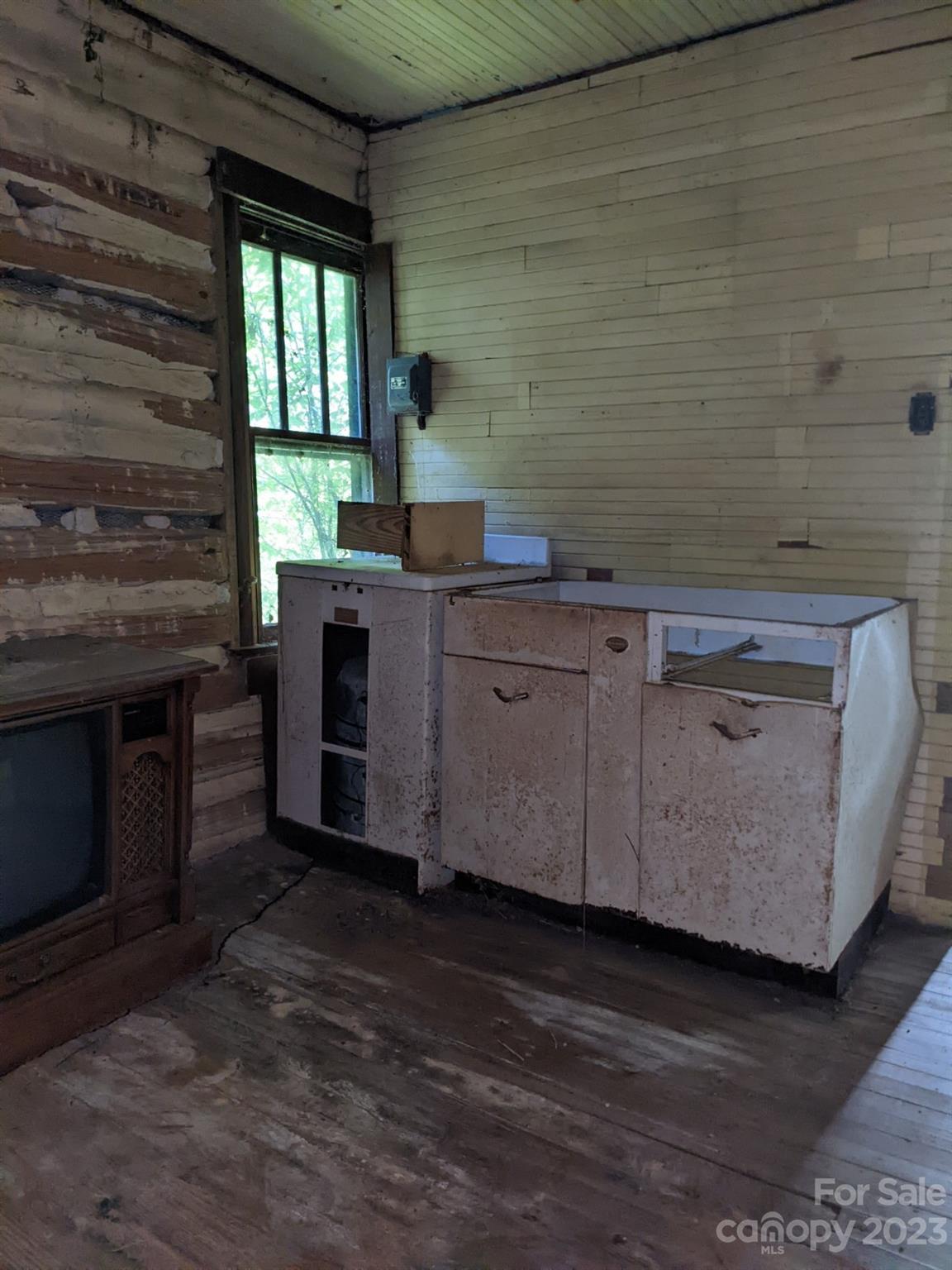 201 Clifford Fowler Road Hot Springs, NC 28743 - Photo 42 of 47 a kitchen with stainless steel appliances wooden cabinets and a stove top oven