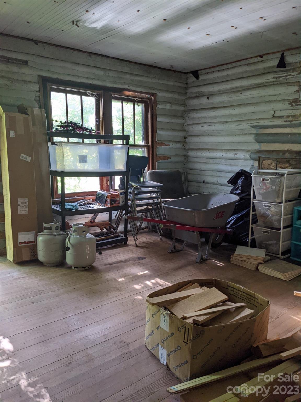 201 Clifford Fowler Road Hot Springs, NC 28743 - Photo 45 of 47 a room with furniture and a chandelier