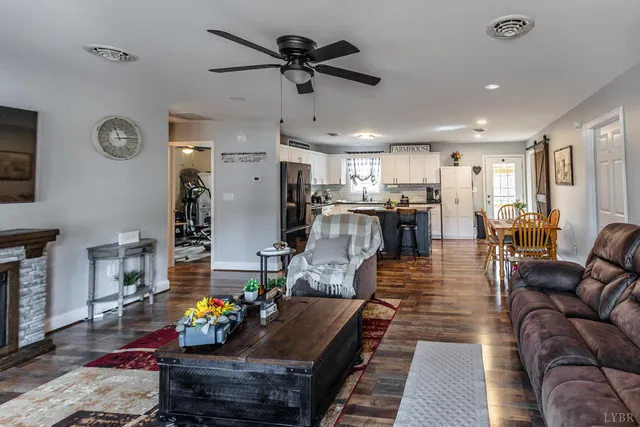 a living room with furniture and a fireplace