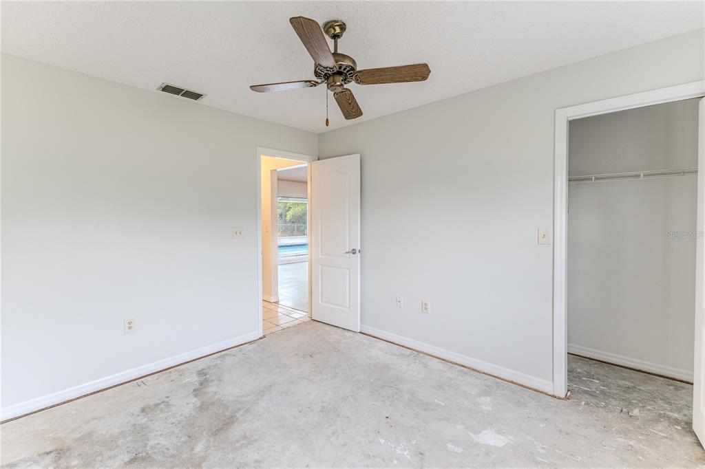 2489 Amherst Avenue Spring Hill, FL 34609 - Photo 21 of 45 a view of a room with a ceiling fan
