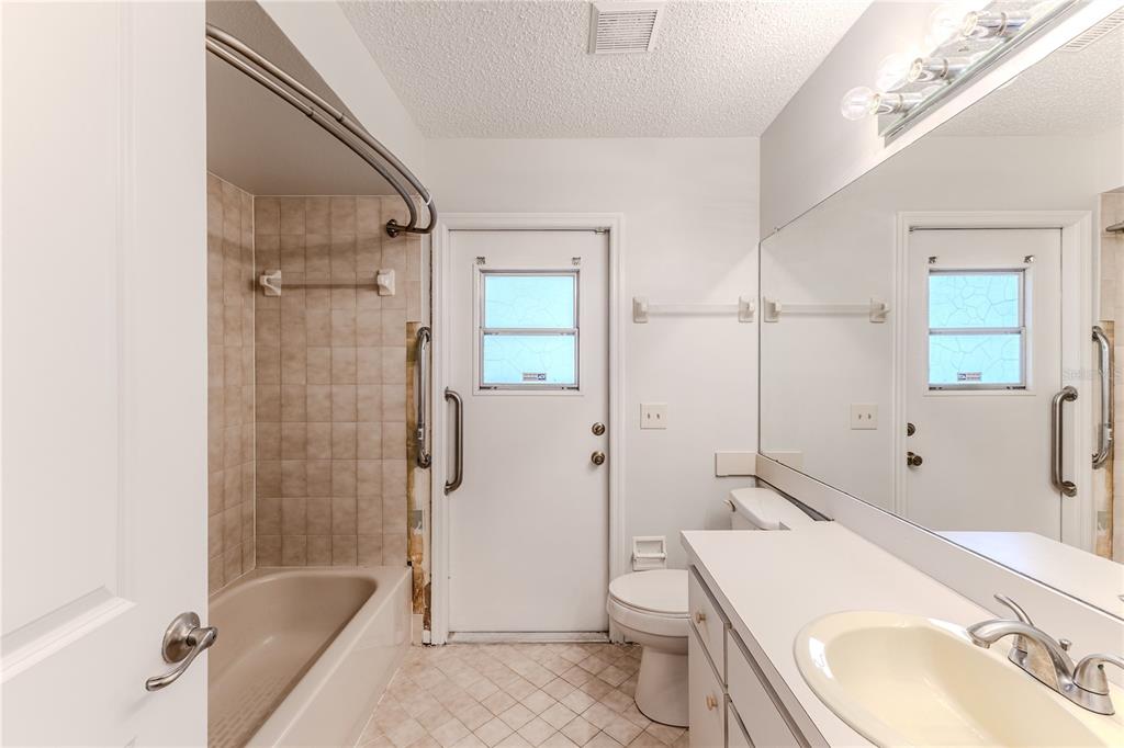 2489 Amherst Avenue Spring Hill, FL 34609 - Photo 23 of 45 a bathroom with a sink a toilet and shower