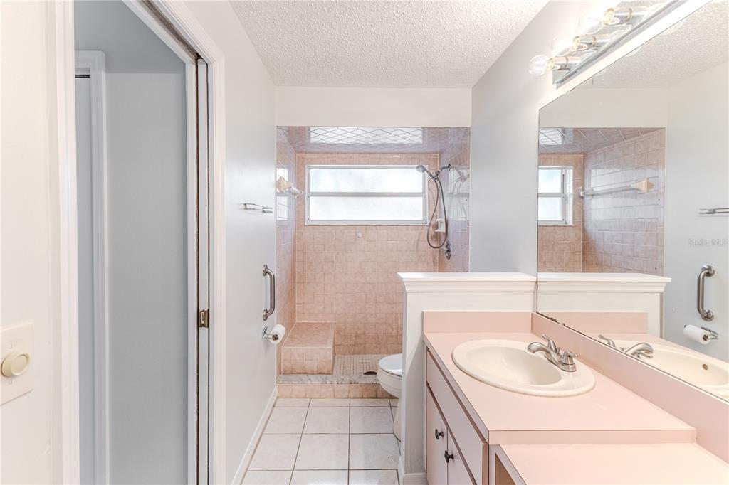 2489 Amherst Avenue Spring Hill, FL 34609 - Photo 28 of 45 a bathroom with a sink and a mirror