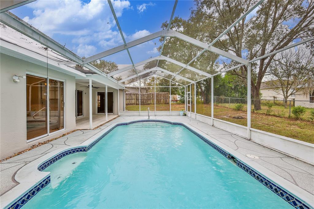 2489 Amherst Avenue Spring Hill, FL 34609 - Photo 3 of 45 a view of a house with a swimming pool