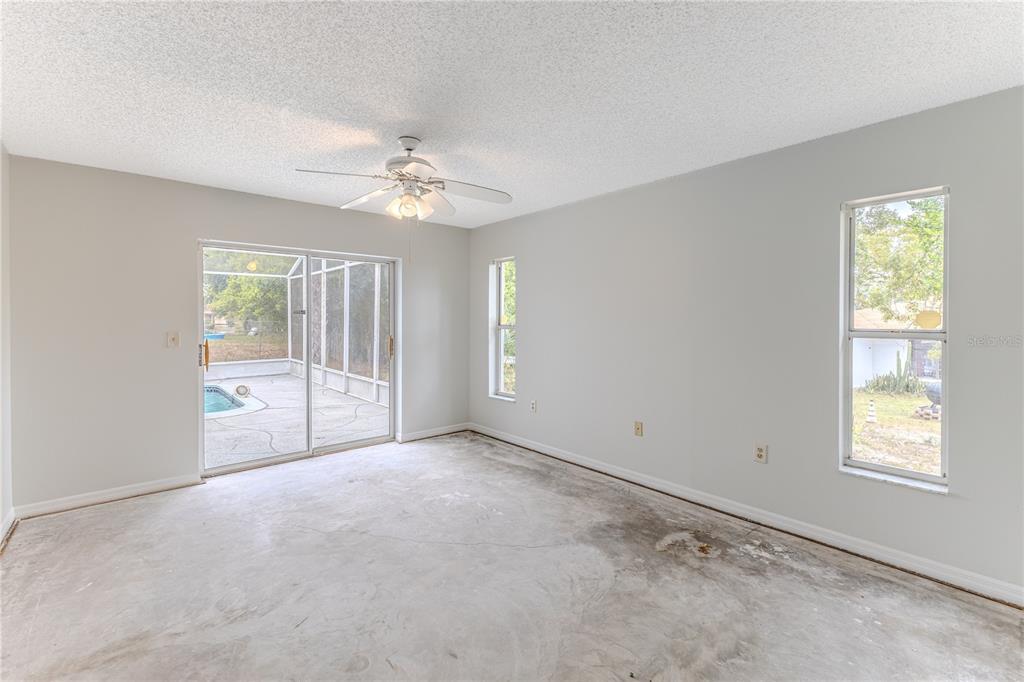 2489 Amherst Avenue Spring Hill, FL 34609 - Photo 31 of 45 a view of an empty room with a window
