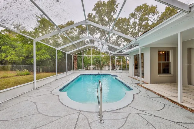 a view of a house with swimming pool