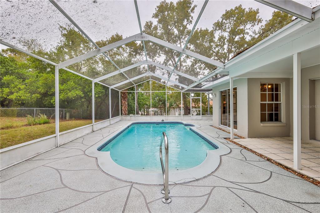 2489 Amherst Avenue Spring Hill, FL 34609 - Photo 36 of 45 a view of a house with swimming pool