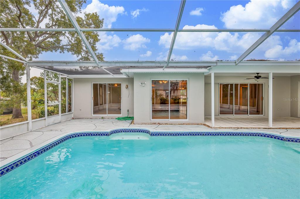 2489 Amherst Avenue Spring Hill, FL 34609 - Photo 37 of 45 a front view of a house with a swimming pool