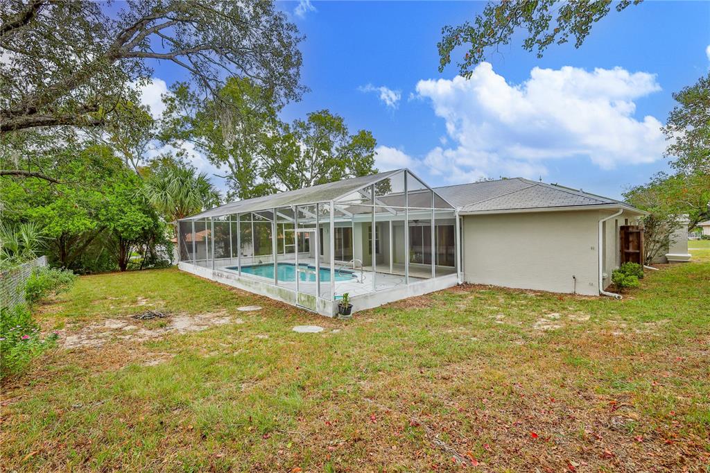 2489 Amherst Avenue Spring Hill, FL 34609 - Photo 42 of 45 a view of a house with a yard