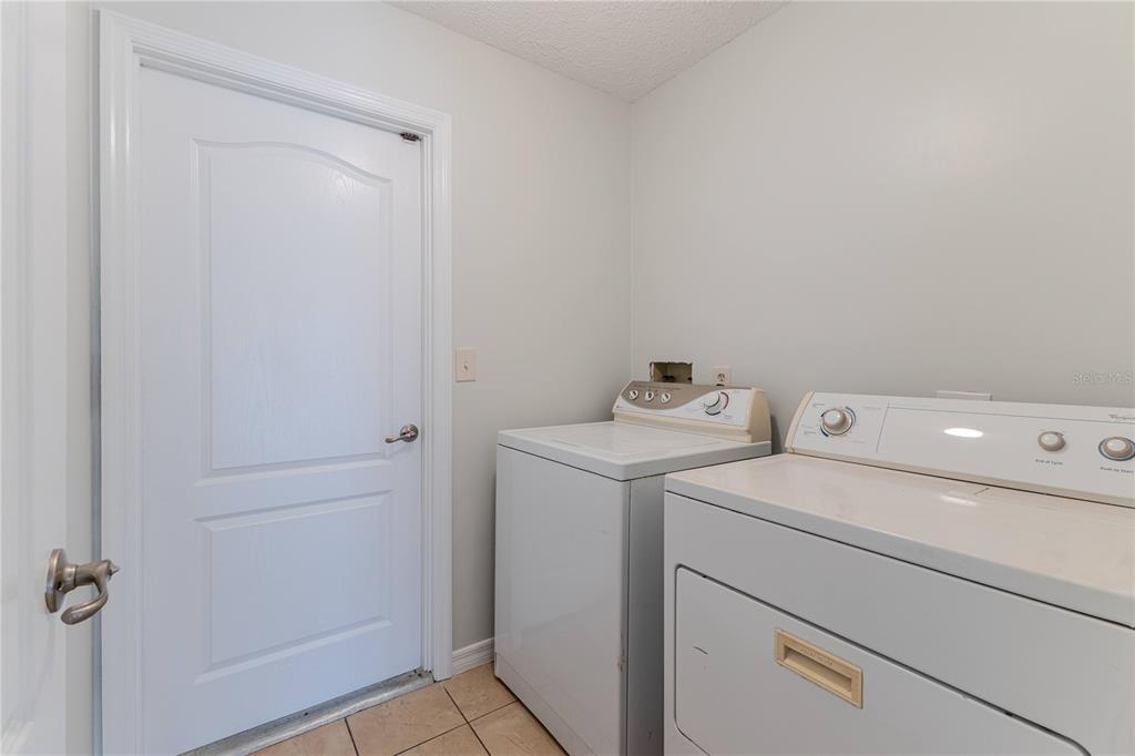 2489 Amherst Avenue Spring Hill, FL 34609 - Photo 43 of 45 a utility room with dryer and washer