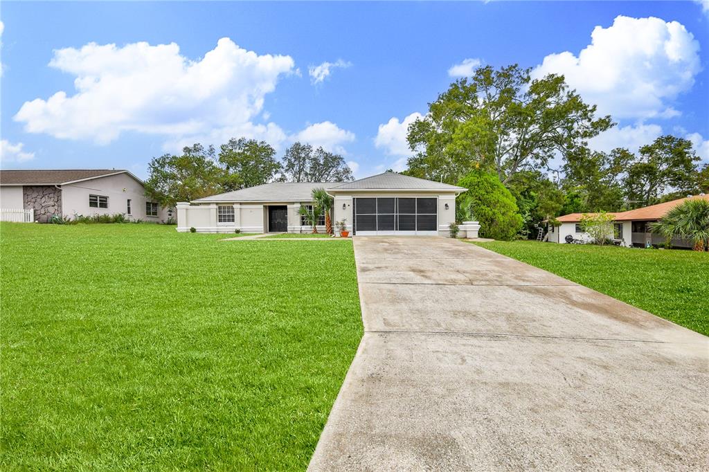 2489 Amherst Avenue Spring Hill, FL 34609 - Photo 45 of 45 a front view of a house with yard
