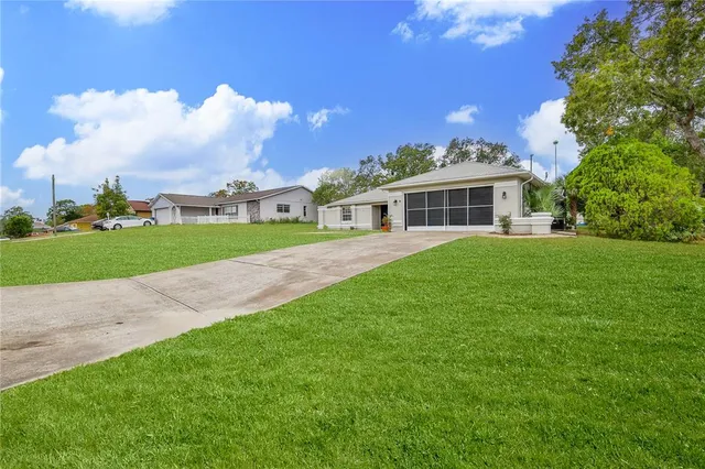 a view of a house with a big yard