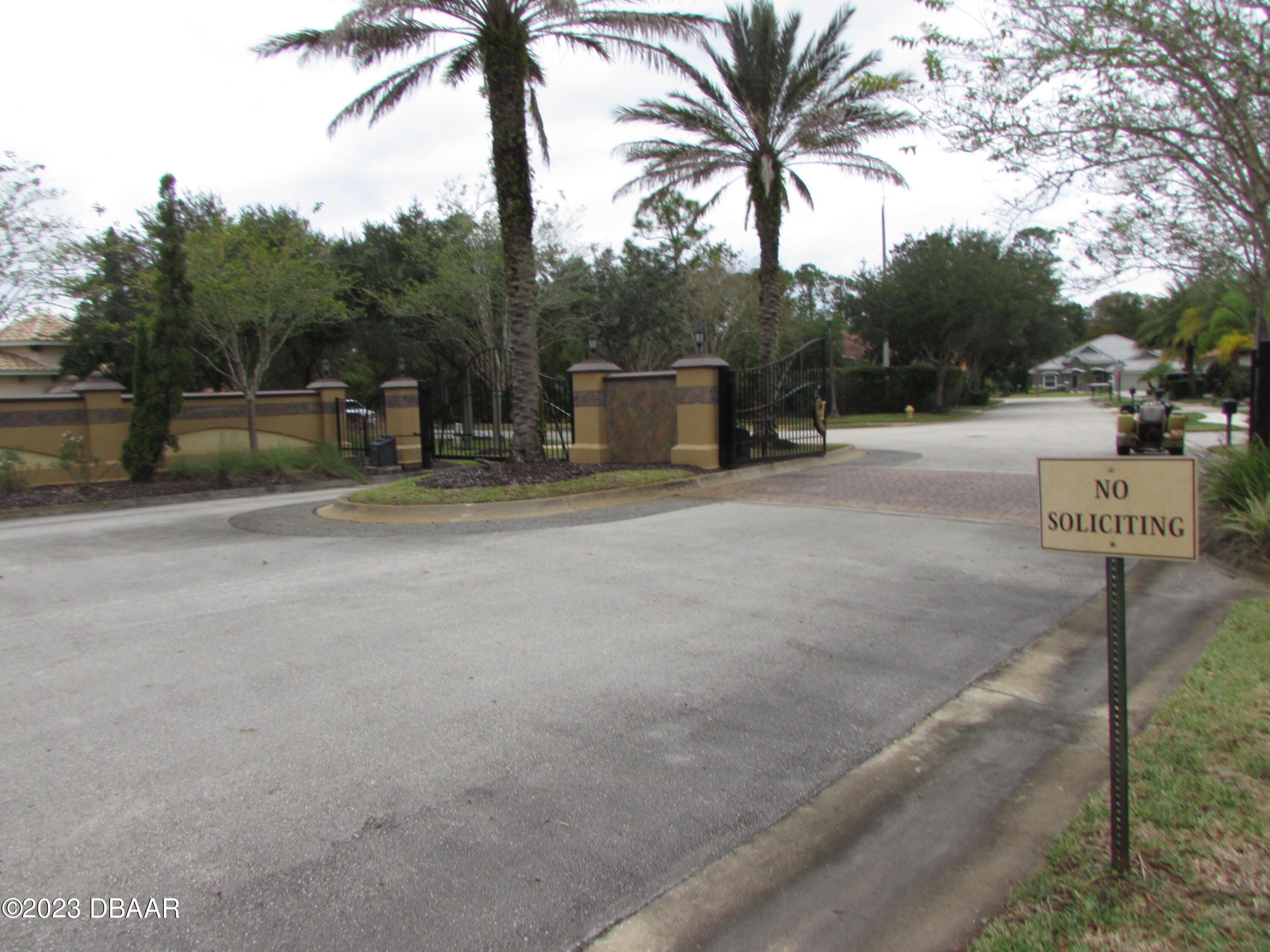 62 Apian Way Ormond Beach, FL 32174 - Photo 11 of 11 a view of a street with a building and palm trees