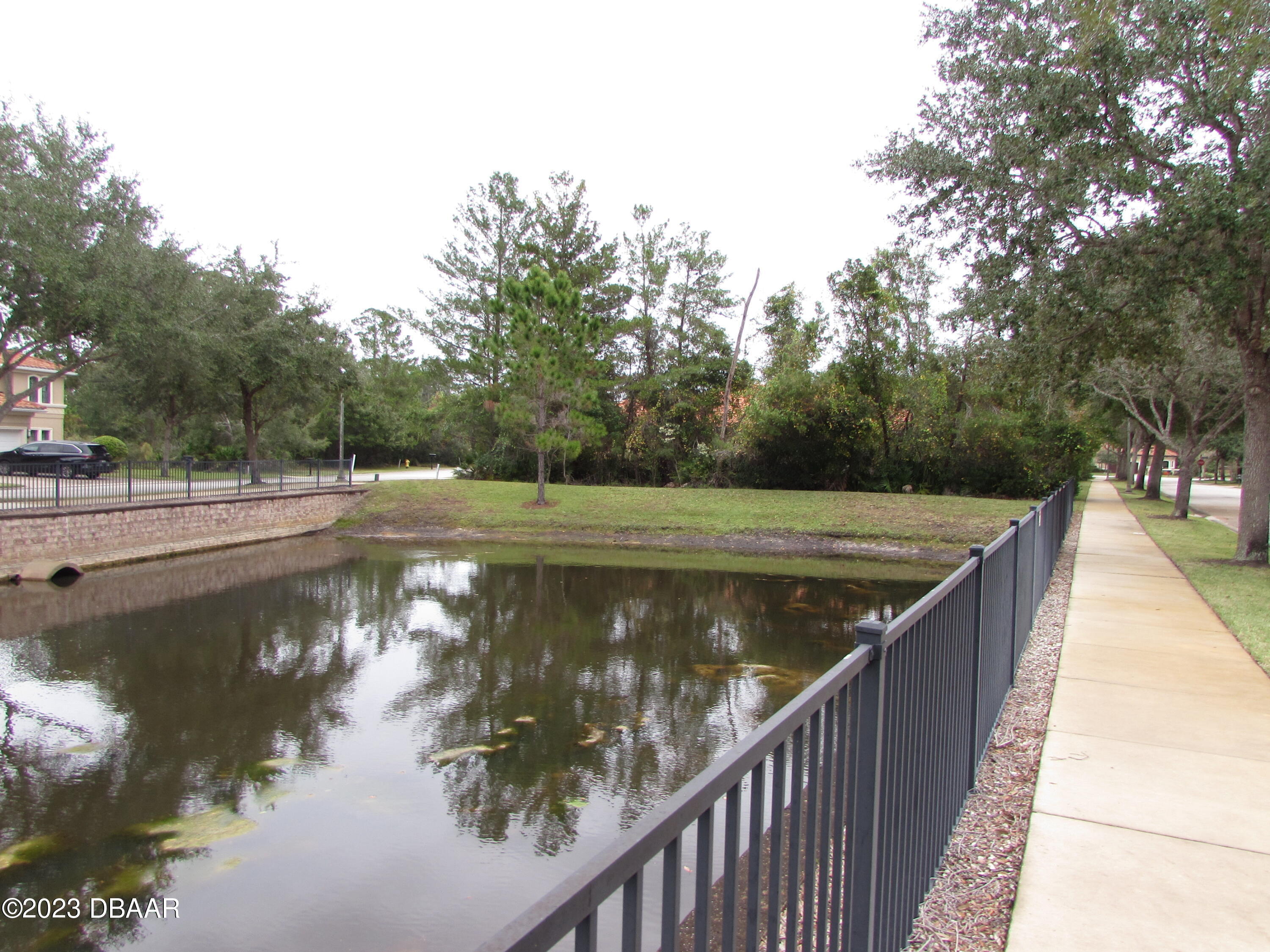 62 Apian Way Ormond Beach, FL 32174 - Photo 6 of 11 a view of a lake with wooden stairs