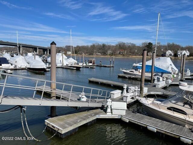 7 River Road, Unit BOAT SLIP G5 Cos Cob, CT 06807 - Photo 8 of 15 a view of roof deck with table and chairs a barbeque