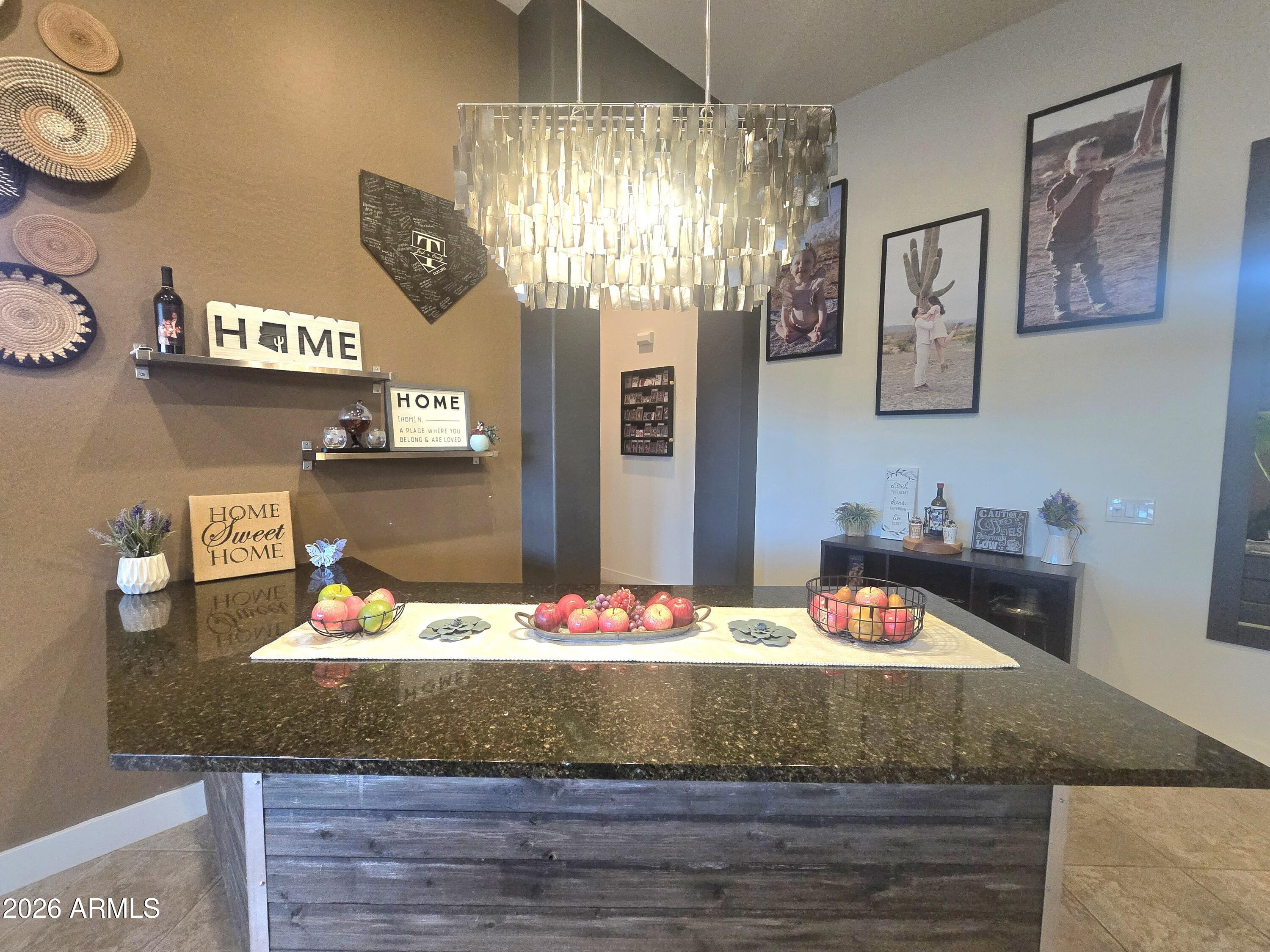 9156 West Bajada Road Peoria, AZ 85383 - Photo 10 of 88 a view of a living room and chandelier